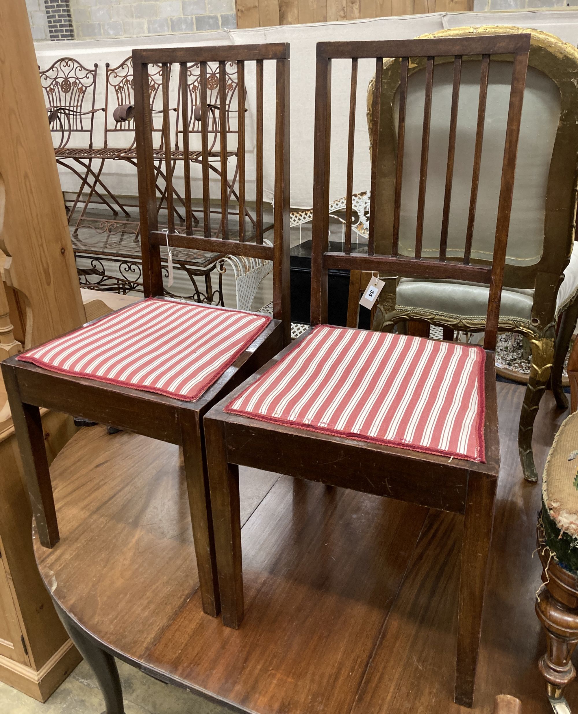 A pair of mahogany bedroom chairs, labelled Beard Watson, Sydney